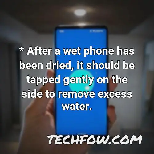 after a wet phone has been dried it should be tapped gently on the side to remove excess water