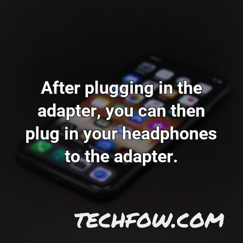 after plugging in the adapter you can then plug in your headphones to the adapter