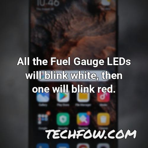 all the fuel gauge leds will blink white then one will blink red