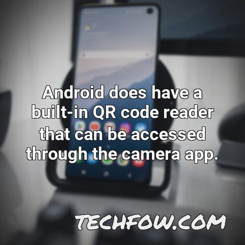 android does have a built in qr code reader that can be accessed through the camera app