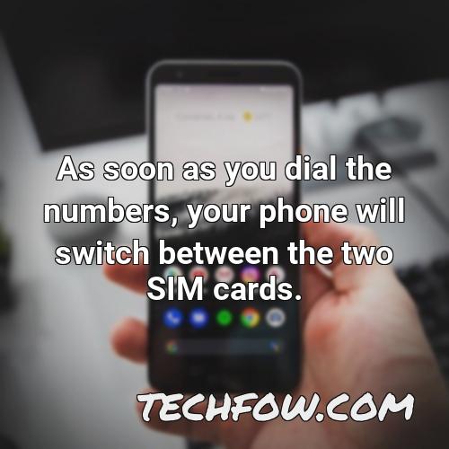 as soon as you dial the numbers your phone will switch between the two sim cards
