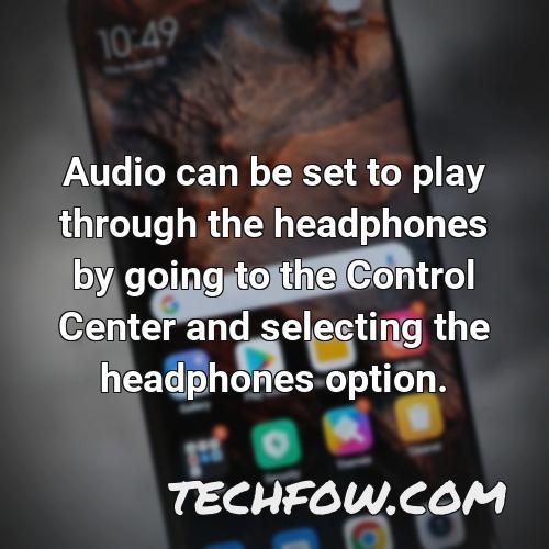 audio can be set to play through the headphones by going to the control center and selecting the headphones option 1