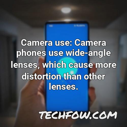 camera use camera phones use wide angle lenses which cause more distortion than other lenses