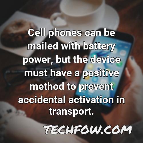 cell phones can be mailed with battery power but the device must have a positive method to prevent accidental activation in transport