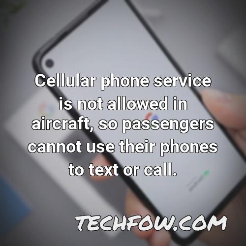 cellular phone service is not allowed in aircraft so passengers cannot use their phones to text or call