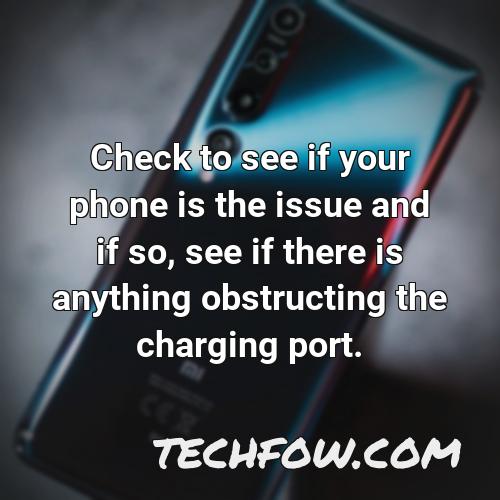 check to see if your phone is the issue and if so see if there is anything obstructing the charging port
