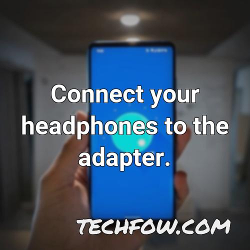connect your headphones to the adapter