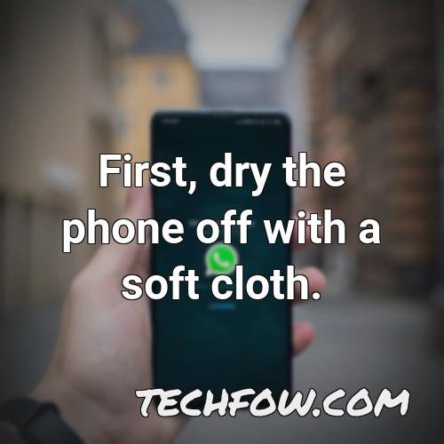 first dry the phone off with a soft cloth