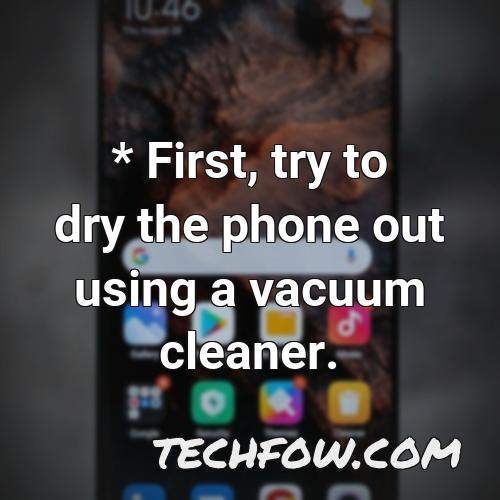 first try to dry the phone out using a vacuum cleaner