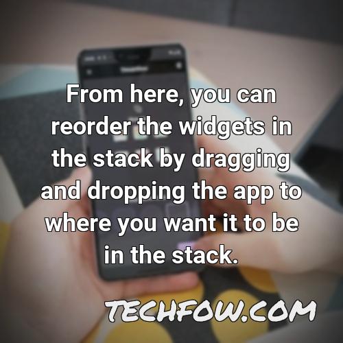 from here you can reorder the widgets in the stack by dragging and dropping the app to where you want it to be in the stack