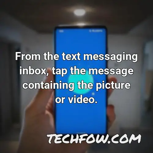 from the text messaging inbox tap the message containing the picture or video