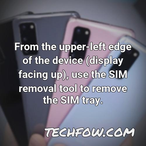 from the upper left edge of the device display facing up use the sim removal tool to remove the sim tray