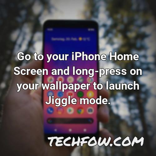 go to your iphone home screen and long press on your wallpaper to launch jiggle mode