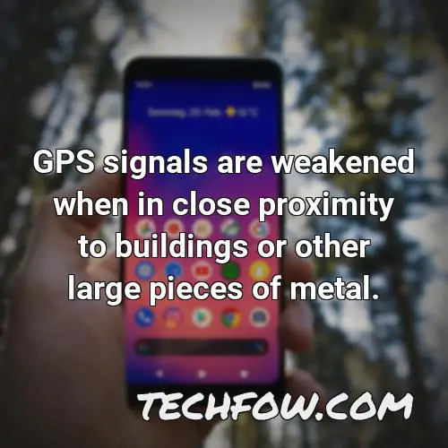 gps signals are weakened when in close proximity to buildings or other large pieces of metal