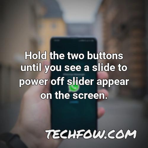 hold the two buttons until you see a slide to power off slider appear on the screen