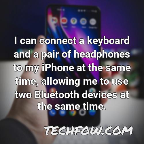 i can connect a keyboard and a pair of headphones to my iphone at the same time allowing me to use two bluetooth devices at the same time