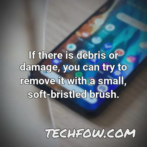 if there is debris or damage you can try to remove it with a small soft bristled brush