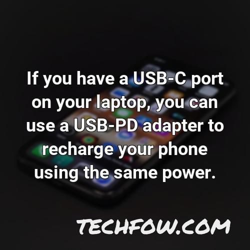 if you have a usb c port on your laptop you can use a usb pd adapter to recharge your phone using the same power