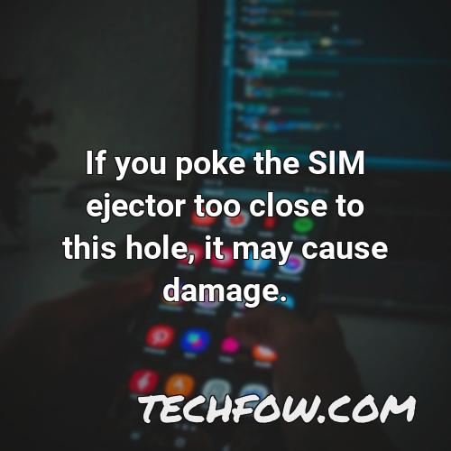 if you poke the sim ejector too close to this hole it may cause damage 1