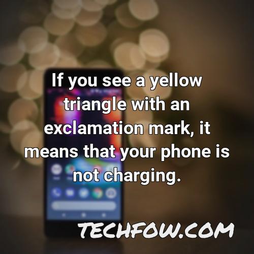 if you see a yellow triangle with an exclamation mark it means that your phone is not charging