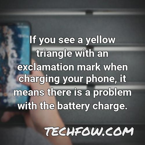 if you see a yellow triangle with an exclamation mark when charging your phone it means there is a problem with the battery charge