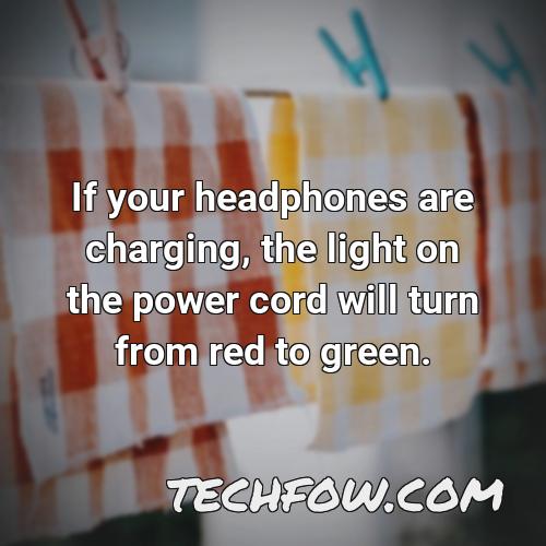 if your headphones are charging the light on the power cord will turn from red to green
