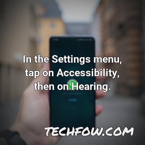 in the settings menu tap on accessibility then on hearing