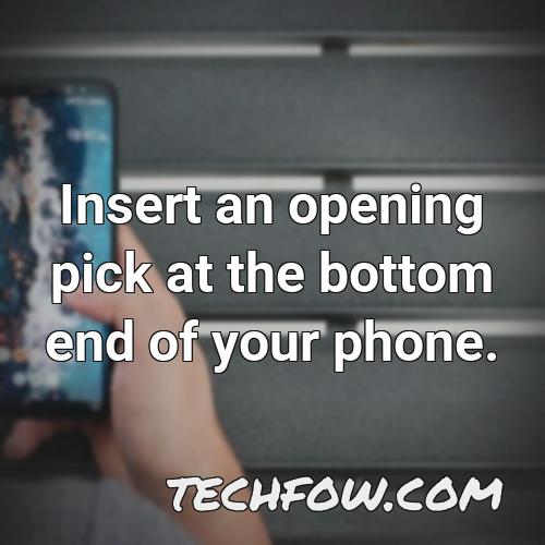 insert an opening pick at the bottom end of your phone