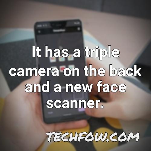 it has a triple camera on the back and a new face scanner