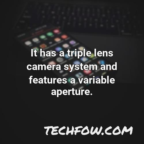 it has a triple lens camera system and features a variable aperture