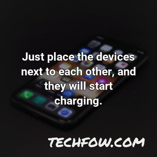 just place the devices next to each other and they will start charging