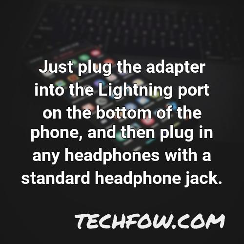 just plug the adapter into the lightning port on the bottom of the phone and then plug in any headphones with a standard headphone jack
