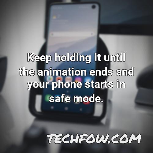 keep holding it until the animation ends and your phone starts in safe mode