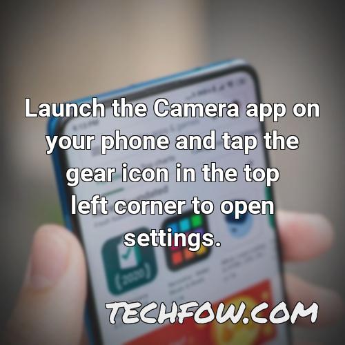 launch the camera app on your phone and tap the gear icon in the top left corner to open settings 1