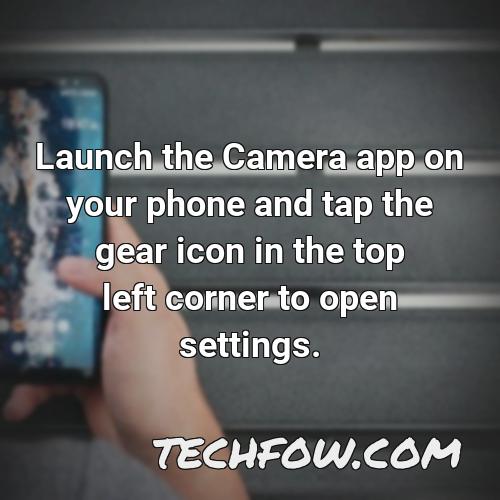 launch the camera app on your phone and tap the gear icon in the top left corner to open settings