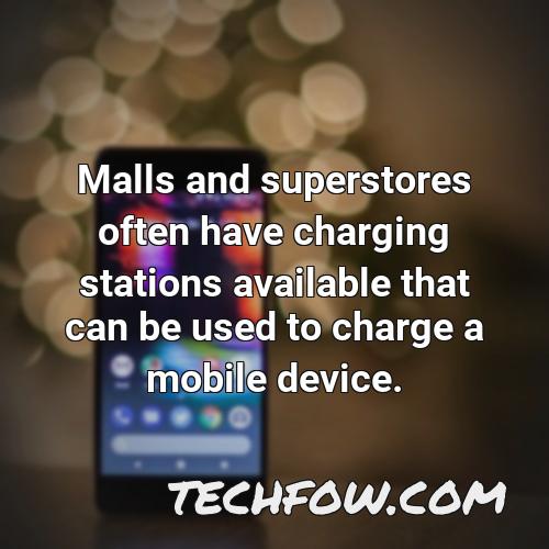 malls and superstores often have charging stations available that can be used to charge a mobile device