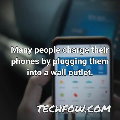 many people charge their phones by plugging them into a wall outlet