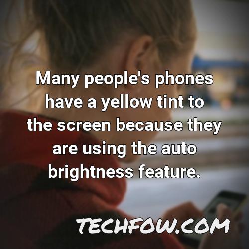 many people s phones have a yellow tint to the screen because they are using the auto brightness feature