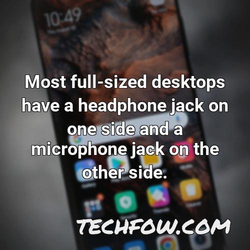 most full sized desktops have a headphone jack on one side and a microphone jack on the other side