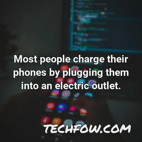 most people charge their phones by plugging them into an electric outlet