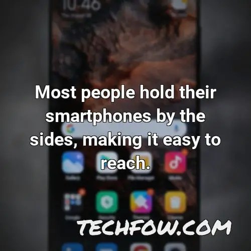 most people hold their smartphones by the sides making it easy to reach