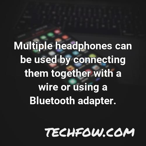 multiple headphones can be used by connecting them together with a wire or using a bluetooth adapter