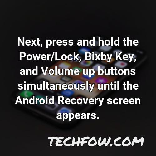 next press and hold the power lock bixby key and volume up buttons simultaneously until the android recovery screen appears