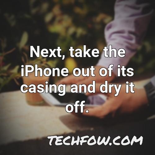 next take the iphone out of its casing and dry it off