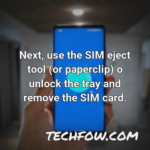 next use the sim eject tool or paperclip o unlock the tray and remove the sim card