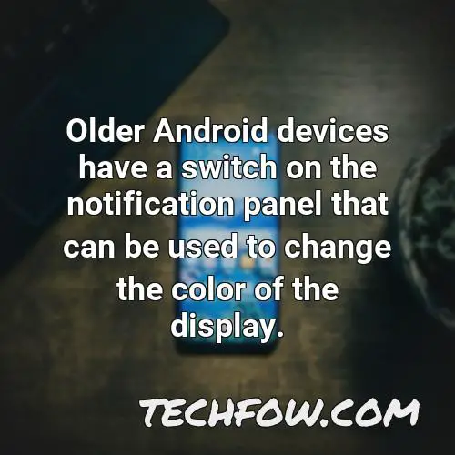 older android devices have a switch on the notification panel that can be used to change the color of the display