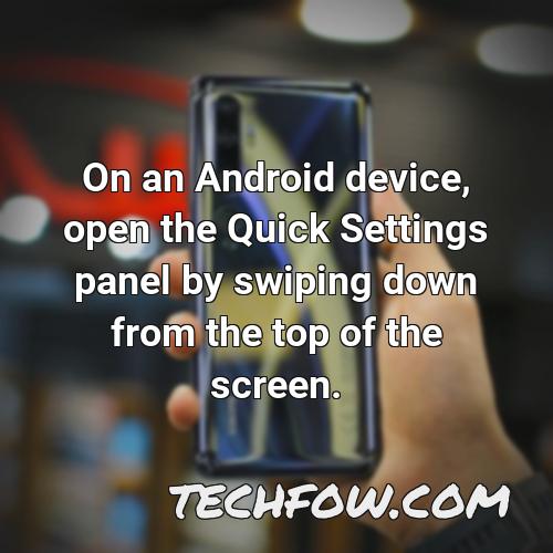 on an android device open the quick settings panel by swiping down from the top of the screen