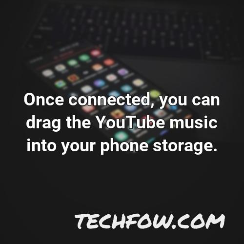 once connected you can drag the youtube music into your phone storage
