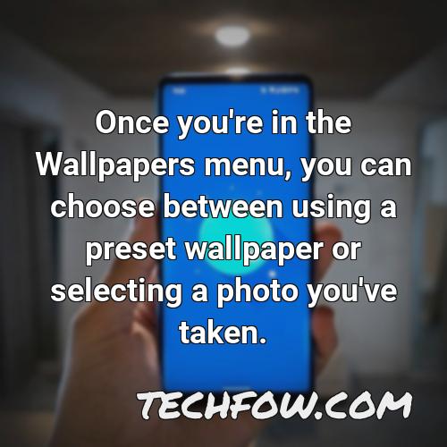 once you re in the wallpapers menu you can choose between using a preset wallpaper or selecting a photo you ve taken