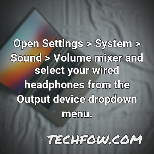 open settings system sound volume mixer and select your wired headphones from the output device dropdown menu
